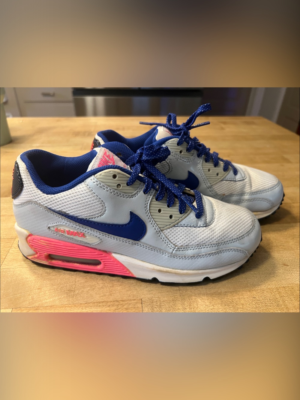 Nike Kids White Sneakers with Blue Swoosh and Pink Midsole Accents